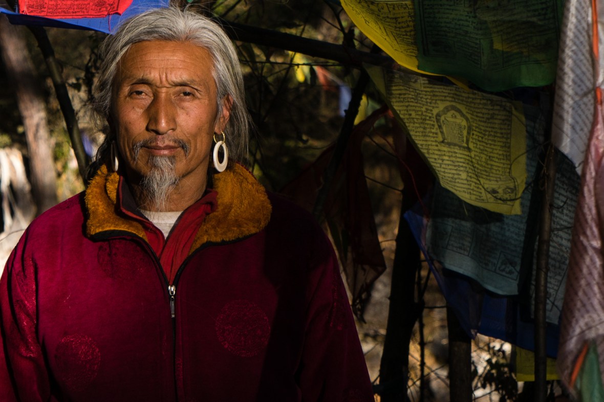 Picture of Monk Tending Shrine at Burning Lake  Bhutan by mcmessner